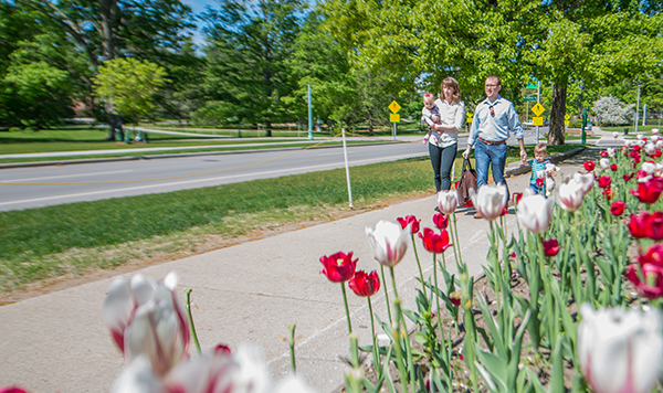 Family walking on campus